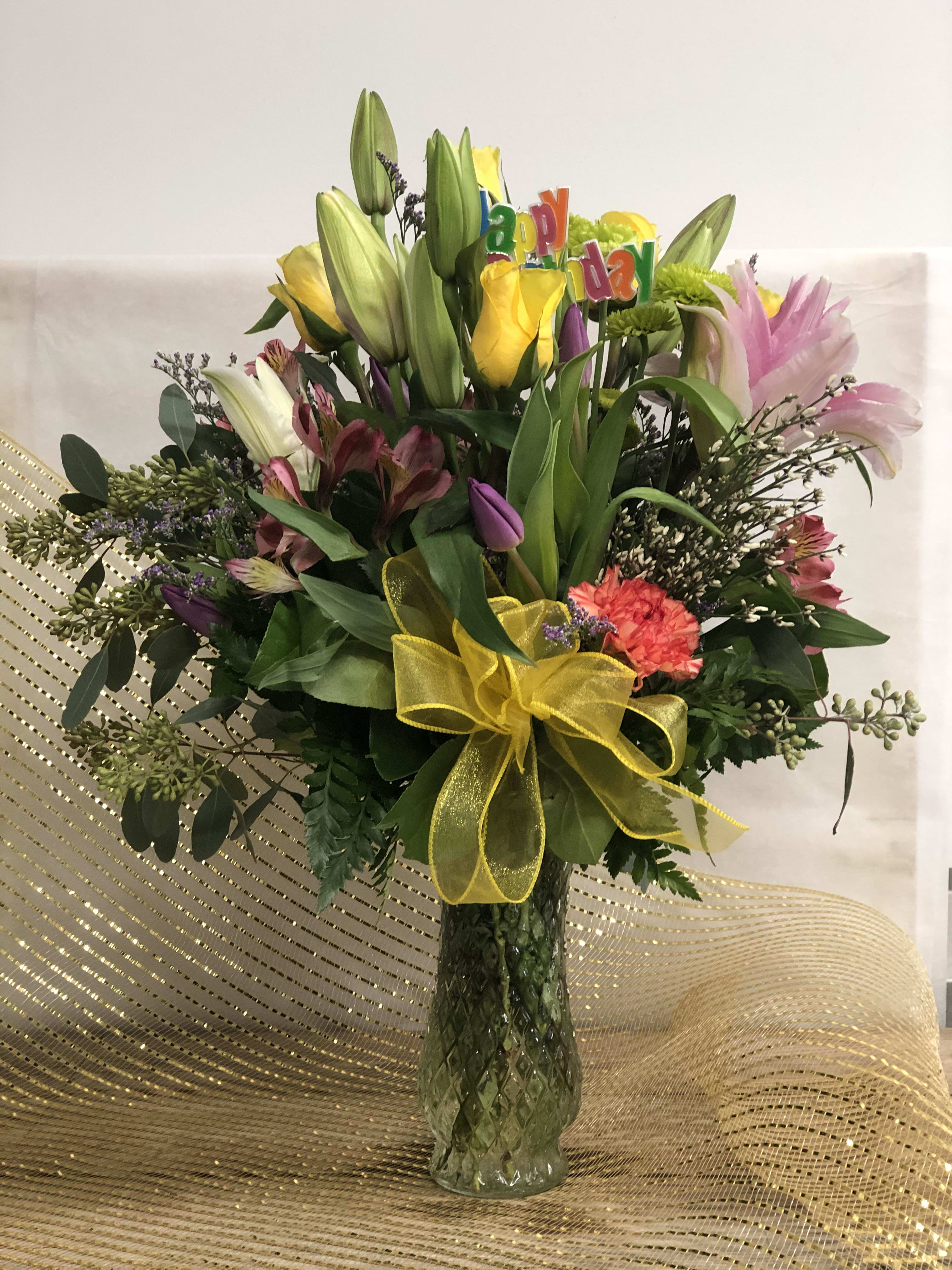 birthday wishes - A bright mixed floral arrangement that is designed with seasonal flowers to make that birthday special. 