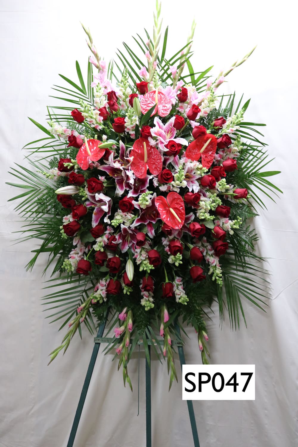 SP047 - large standing easle with  red Antheriums, Pink Lillies, Red Roses, Pink Snapdragon, Pink Gladiolas, Red Roses
