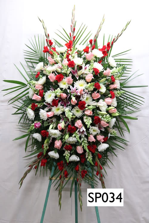 SP034 - Red Gladiolas, Red Carnations, Pink Roses, Pink Lillies, White China Mums, White Snapdragon