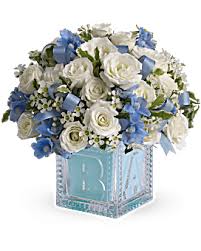 Baby Boy's First Block - He'll be building block castles soon enough! For now, celebrate his life with this beautiful keepsake baby block. Filled with blues and whites, the glass block can be used later in baby's room and makes a memorable baby boy present.