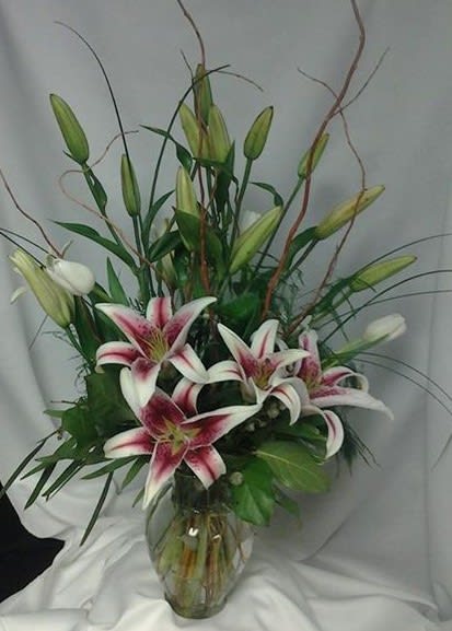 Beautiful Gazer  - Stargazers and mixed greens in a vase that any stargazer fan will love.