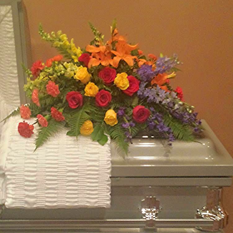 How To Make A Casket Spray : Taking a few at a time place their cut ends.