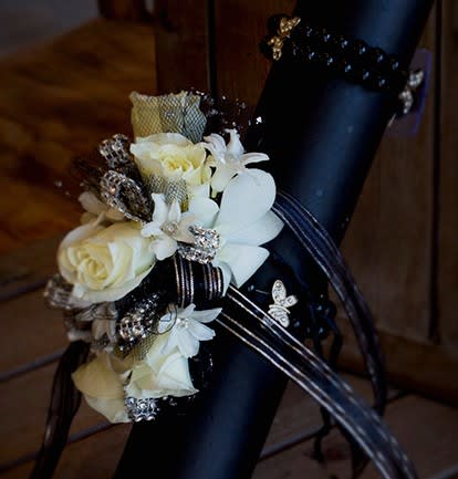 Black and Silver Wrist Corsage - Black beaded bracelet adorned with silver butterflies and decorated with spray roses, hyacinth, and dendrobium orchids.