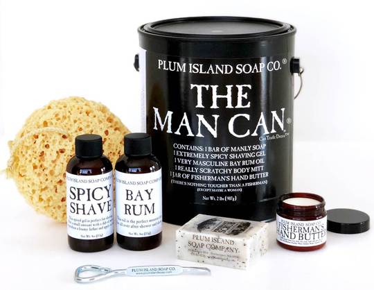 The Man Can - THE MAN CAN ® is perfect for the guy who has everything! Chock full of our handcrafted, 100% all natural skincare products presented in a masculine black hybrid, paint style can. Not only will the receiver love the clean, fresh scents but he won't be able to resist the manly packaging with dual bottle/paint can opener. Contents include Fisherman’s Scrub Soap &amp; Hand Butter, Spicy Shave Gel, Bay Rum Oil and Sea Sponge. A sure hit for your gift giving buyers!      Contains 1 Bar Soap. 1 Shave Gel, 1 Bay Rum Oil, 1 Hand Butter, and 1 Scratchy Body Accessory (varies due to stock). Packaged in a One Gallon Paint Can. Label color is currently our classic white.    