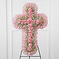 The Angel Cross FTD (PINK AS SHOWN BUT CAN REQUEST OTHER COLORS) - *PLEASE NOTE: WE ARE ABLE TO DESIGN IN DIFFERENT COLORS OF YOUR CHOICE.   CALL US FOR DETAILS* The FTD® Angel's Cross™ Easel is a graceful tribute to honor the life and faith of the deceased. Pink mini carnations and baby's breath are lovingly arranged in the shape of a cross, accented with a pink satin ribbon around the outside and displayed on a wire easel, to create a wonderful way to express your love for the departed. Approximately 24&quot;H x 15&quot;W. Your purchase includes a complimentary personalized gift message.  NOT THE RIGHT COLOR?  WE CAN CUSTOMIZE ANY ORDER FOR YOU.  CALL US TO ADD TO NOTES IF YOU WOULD LIKE TO CUSTOMIZE THIS EASEL.  