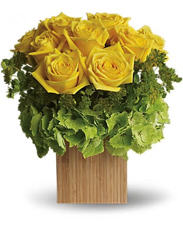 Teleflora's Box of Sunshine - Let the sunshine in! This brilliant mix of flowers is hand-delivered in natural bamboo cube. You can&#039;t help feeling happy and warm all over just by looking at it.