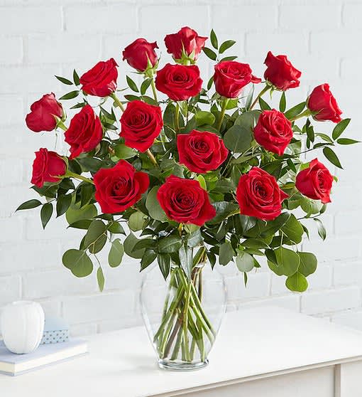 Heart’s Desire Long Stem Red Roses - She might be into you now, but she’ll totally fall for you when you give her these. Just like her, our long-stem red roses are romantic, flirtatious, and strikingly attractive. The perfect Valentine’s gift for your heart’s desire. All-around arrangement of long-stem red roses with assorted greenery Medium 18-stem arrangement measures approximately 25.5”H x 27”W Artistically designed in a classic garden vase; measures 11”H Our florists select the freshest flowers available, so colors, varieties and container may vary due to local availability