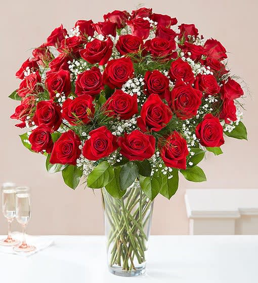 ltimate Elegance™ Long Stem Red Roses - Our luxurious long stem red roses are the ultimate surprise to say “I love you.” Two, three or four dozen radiant blooms are artistically arranged by our expert florists inside an elegant glass vase and personally hand-delivered to help you say how you feel in a truly romantic way. All-around arrangement with 24, 36 or 48 long stem red roses; accented with baby’s breath and assorted greenery Our florists select the freshest flowers available, so shade of rose may vary due to local availability Artistically arranged in a classic clear glass vase