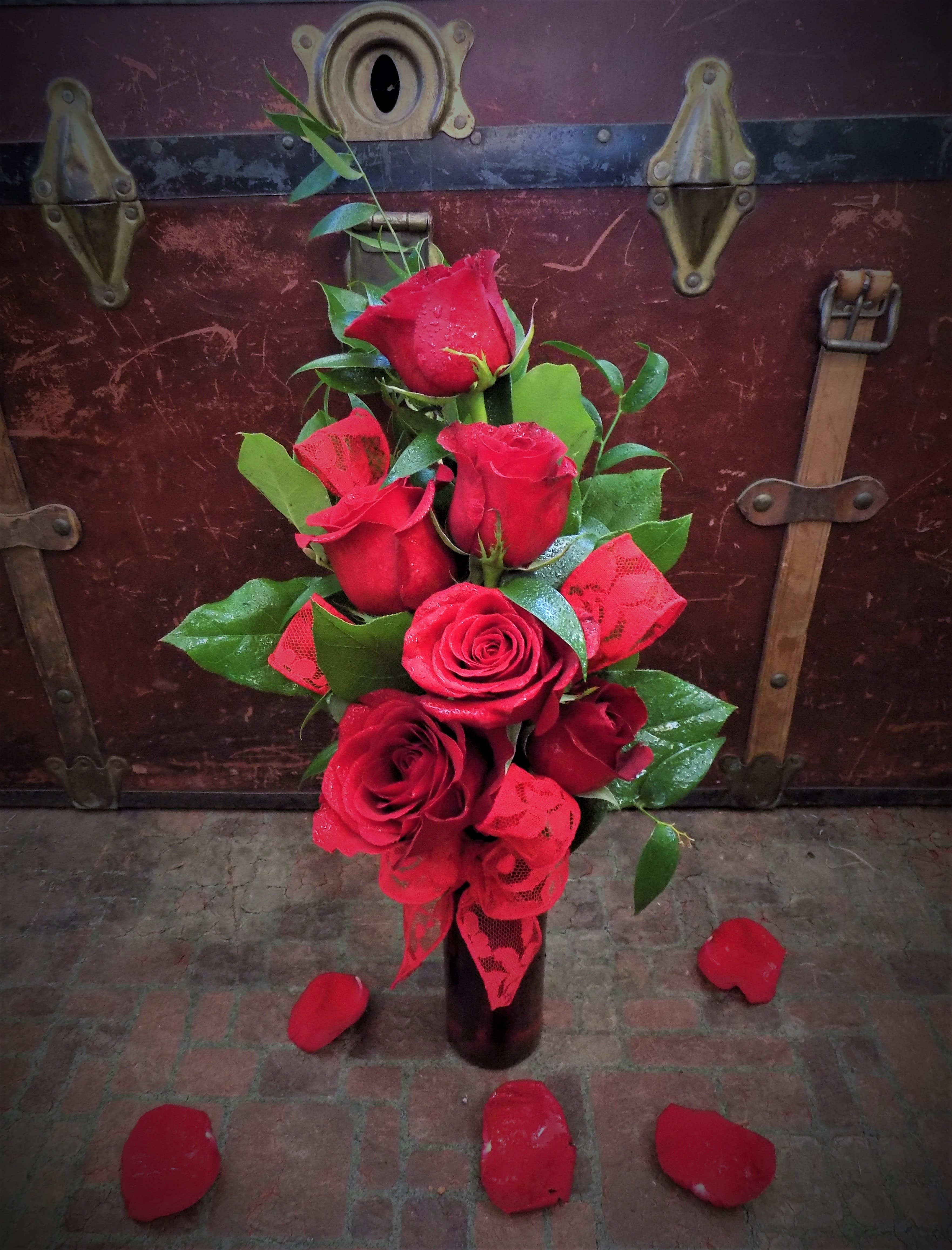 &quot;Wink, Wink&quot; Bouquet - Six crimson roses arranged in a ruby vase and accented with red lacy ribbon will be sure to be the perfect way to celebrate your love for that someone special. 
