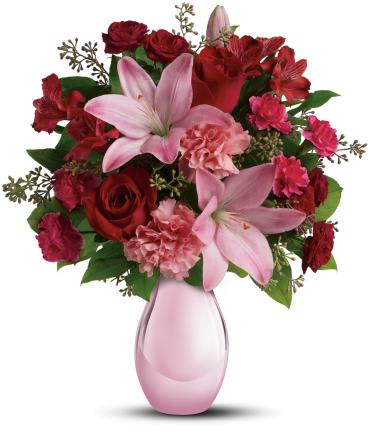 Roses and Pearls Bouquet -   She'll be delighted when she receives this gorgeous array of roses, lilies and more artistically arranged in a dazzling pink reflections vase. It's a gorgeous gift that she'll love now and cherish forever.  This gorgeous bouquet includes red roses, red spray roses, pink asiatic lilies, red alstroemeria, pink carnations and pink miniature carnations accented with assorted greenery. 