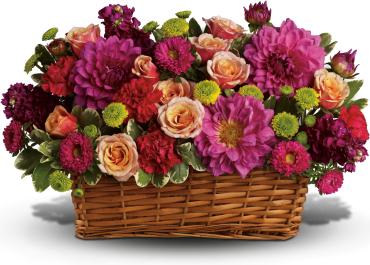 Burst of Beauty Basket -   Color outside the lines with this incredible basket of summer flowers! Pops of hot pink, pale orange, deep purple and bright green spill over the sides of a rectangular basket. It's an exciting, heartfelt gesture to send a stylish friend, a colorful girlfriend or anyone who needs perking up. Hot pink flowers - dahlias, matsumoto asters and carnations - are arranged with pale orange roses, purple stock and bright green button mums in a natural rectangular basket. 