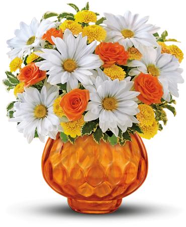 Rise and Sunshine -   Happy as a country sunrise, this delightful bouquet features orange roses and white daisies in orange cut-glass votive bowl. When the flowers are gone, they can light a candle and have indoor sunshine forever. They'll adore it.  The cheerful bouquet includes orange spray roses, white daisy spray chrysanthemums and yellow button spray chrysanthemums accented with fresh greenery. 