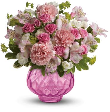 Simply Pink Bouquet -   Nothing's prettier than pink - and this bouquet is bursting with it! Delicate roses and alstroemeria look even more delightful in our brilliant gem vase, a gift she can enjoy for years to come as an elegant votive candle holder!  Includes pink roses, pink alstroemeria, pink and white carnations, bupleurum and variegated pittosporum. 