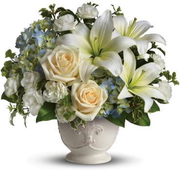 Beautiful Dreams -   This French country style sympathy arrangement communicates your condolences in a most heartfelt way. It's a lovely choice when you want to send flowers to family or friends.  A beautiful bouquet of blue and white sympathy flowers - blue hydrangeas, crme roses, white miniature carnations, fragrant white asiatic lilies and green pitta negra - are delivered in a French Country Pot. 