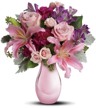 Enchanting Pinks -   Imagine her joy when she opens the door and sees this incredible array of roses, lilies and other favorites in an elegant pink reflections vase. She'll be talking about it for weeks.  The exquisite bouquet includes pink roses, light pink spray roses, light pink oriental lilies, purple alstroemeria and fuchsia carnations accented with assorted greenery. 