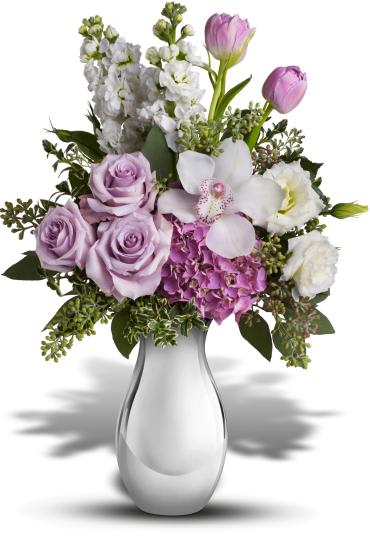 Breathless Bouquet -  When we say it will leave her breathless, we're not exaggerating. She'll be swept away by the lush lavender roses, white orchid and other fabulous favorites in a Silver Reflections vase. 