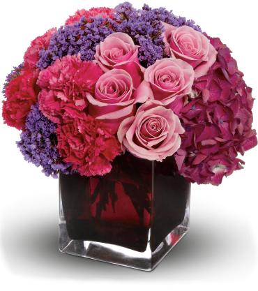 Enchanted Journey - A fairy tale of flowers! Send this whimsical, feminine bouquet to your very own princess - or anyone you especially adore. Beautiful hydrangea, fragrant roses and delicate statice in a modern purple vase ensure your lucky recipient will live happily ever after! 