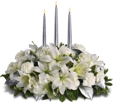 Silver Elegance Centerpiece -   Blanket your holiday table in elegance with this lush white floral Christmas centerpiece. Beautiful white hydrangeas and lilies form a snow white cloud beneath three slender silver candles.  White flowers, including hydrangeas, asiatic lilies and carnations - are combined with deep green salal, variegated pittosporum and silver leaves beneath three silver taper candles. 