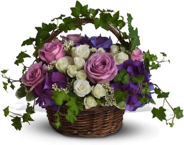A Full Life -  Lush flowers to celebrate a full life. This beautiful basket of flowers for a funeral or home evokes the natural beauty of life with purple hydrangeas, lavender and white roses and winding green ivy. 