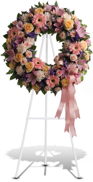 Graceful Wreath -   Family and friends will recollect how special their loved one was with this gentle ring of pastel blooms. Highlighted with a pink satin ribbon, it is a lovely reminder of sweet memories and beautiful times shared. 