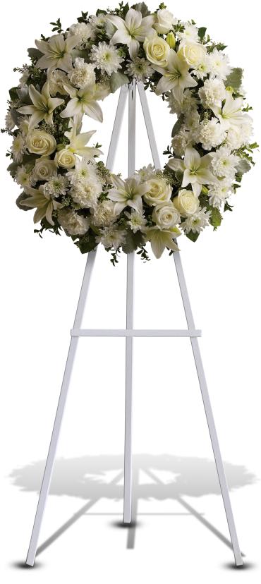 Serenity Wreath -   Fragrant and ethereal white blossoms set among a ring of soothing greens form a classic wreath certain to evoke the pure heart and gentle spirit of a loved one - and offer consolation during a funeral or wake. 