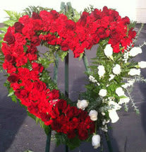 A HEART TO REMEMBER EASEL -  ONE OF THE FAVORITES, A HEARTFELT DISPLAY FEATURING RED ROSES...SITS ELEGANTLY ON A 5 FOOT EASEL 