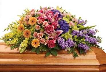 Garden of Sweet Memories Casket Spray -   A loved one may have passed, but the memory of many happy times together will last forever. This radiant, multicolored spray is a tribute to that spirit. 