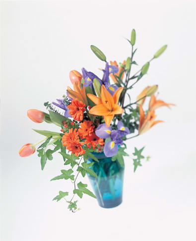 YOU ARE A BREATH OF FRESH AIR BOUQUET YOU ARE A BREATH OF FRESH AIR BOUQUET - BEAUTIFUL FRESH ORANGE AND BLUE TONES. FLOWERS SUCH AS IRIS, ROSES, LILIES AND MORE