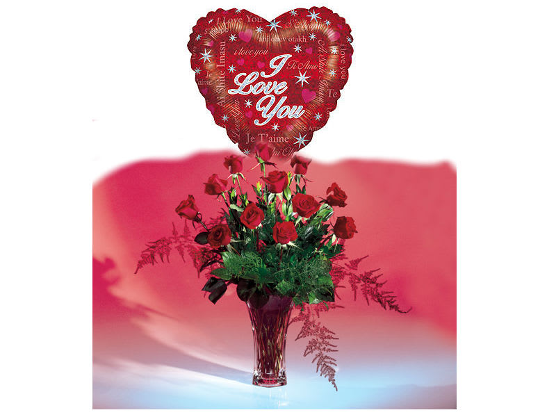 PRECIOUS LOVE ROSES AND MYLAR PRECIOUS LOVE ROSES AND MYLAR - BEAUTIFUL DOZEN RED LONG STEM ROSES IN A VASE WITH MYLAR