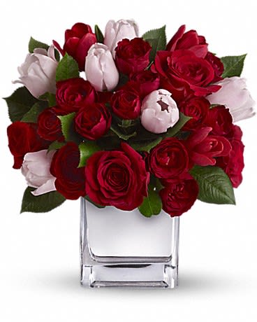 Teleflora's It Had to Be You Bouquet - She&#039;s your one and only. Doesn&#039;t she deserve an equally singular bouquet? This charming heartfelt arrangement puts a feminine spin on classic red roses by mixing in elegant red and pink tulips. Presented in our modern Mirrored Silver Cube it&#039;s a uniquely stunning selection for any day you want to pamper your special one.