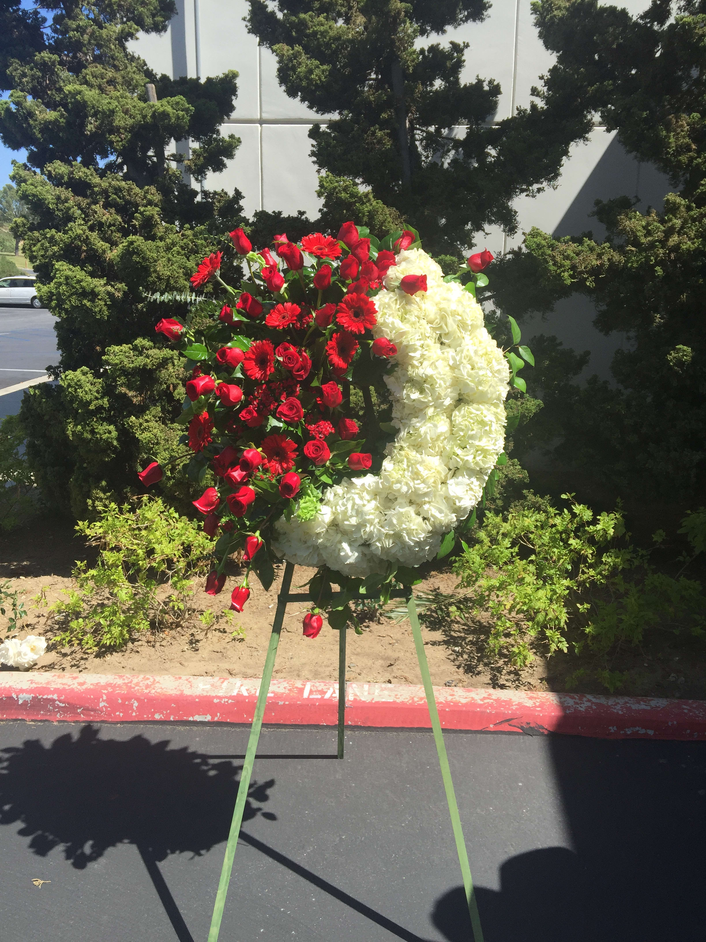 SUPER SALE WAS $290- EVERLASTING LOVE WREATH - SEND YOUR SINCERE CONDOLENCES WITH A GRAND DISPLAY OF IMPORTED ROSES, GERBERS AND HYDRANGEA, ARTICALLY DESIGNED. 5 FOOT EASEL APPOX- 30 INCHES DIA.