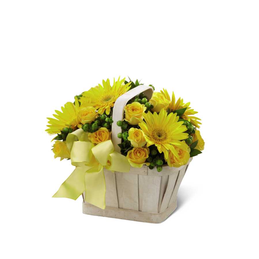 The FTD Uplifting Moments Basket - The FTD Uplifting Moments Basket is a guaranteed way to lift any mood and spread cheer with each sunlit petal! Bright yellow gerbera daisies and spray roses burst with vibrant energy arranged amongst green hypericum berries and myrtle greens in a simply stylish whitewash basket. Bedecked with a lemon yellow wired ribbon this bouquet proclaims an abundance of light and hope.