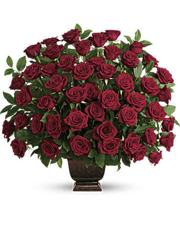 Teleflora's Rose Tribute Bouquet - As true as the love symbolized by a red, red rose are the heartfelt memories and deep feelings embraced with this classic and elegant expression of tribute. Three dozen red roses, accented by salal, are presented in an exclusive Noble Heritage Urn. Orientation: One-Sided