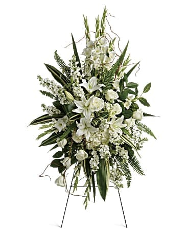 Heartfelt Sympathy Spray - A peaceful display of your heartfelt sympathy, this pure white spray of hydrangea, roses and lilies brings a natural serenity to the service. This beautiful spray includes white hydrangea, white roses, white oriental lilies, white gladioli, white stock, pitta negra, sword fern, curly willow, variegated aspidistra leaves, and lemon leaf. Delivered on a wire easel.