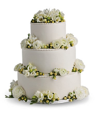Freesia and Ranunculus Cake Decoration - Fragrant snow white blooms and green berries add soft natural beauty to your cake.