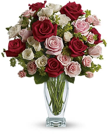 Cupid's Creation with Red Roses by Teleflora - Classic beauty and romance to spare thanks to the graceful lines of a Couture Vase filled with stunning roses - the iconic flower of love. Like the arrow released from Cupid's bow this gorgeous bouquet will go straight to your lover's heart.