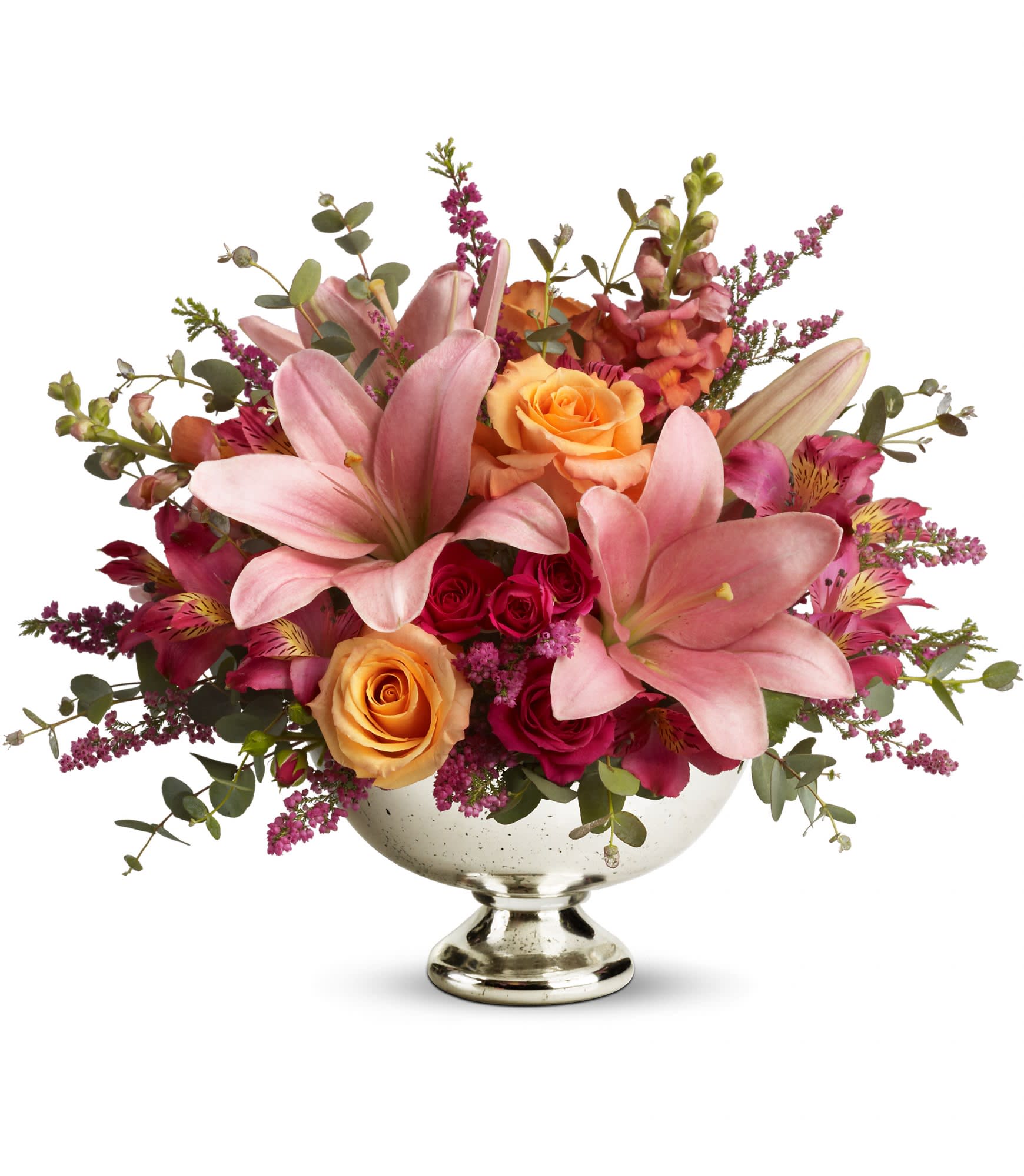 The Belle - Bowl someone over with this bounty of beautiful blossoms. Stunning. Spectacular. Stylish. Perfect for any occasion at home or anywhere, there's always room for a bouquet like this!  Light orange roses, hot pink spray roses, pink asiatic lilies and heather, dark pink alstroemeria and lovely orange snapdragons arrive in style. Arrives in an exclusive Mercury Glass Bowl. Blooming beautiful.  Approximately 16&quot; W x 13 1/2&quot; H  Orientation: All-Around      As Shown : Premium- see second picture for example      