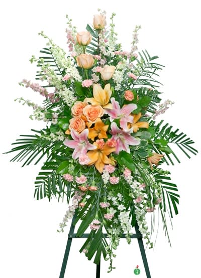 Spirit of Hope Standing Spray - Share the spirit of hope and faith with a generous standing spray of pink and orange blossoms – including lilies, roses and carnations – against a backdrop of fresh palm fronds. A lovely way to express your sympathies.