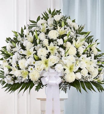 All White Heartfelt Sympathies (FB14) All White Heartfelt Sympathies (FB14) - Symbolizing peace, serenity and purity, white flowers can help comfort those grieving the loss of someone they loved dearly. Our majestic standing basket arrangement in angelic white is an impressive tribute to their memory. Artistically designed by expert florists with an abundance of pristine white blooms, it is a heartfelt expression of your deepest sympathies.