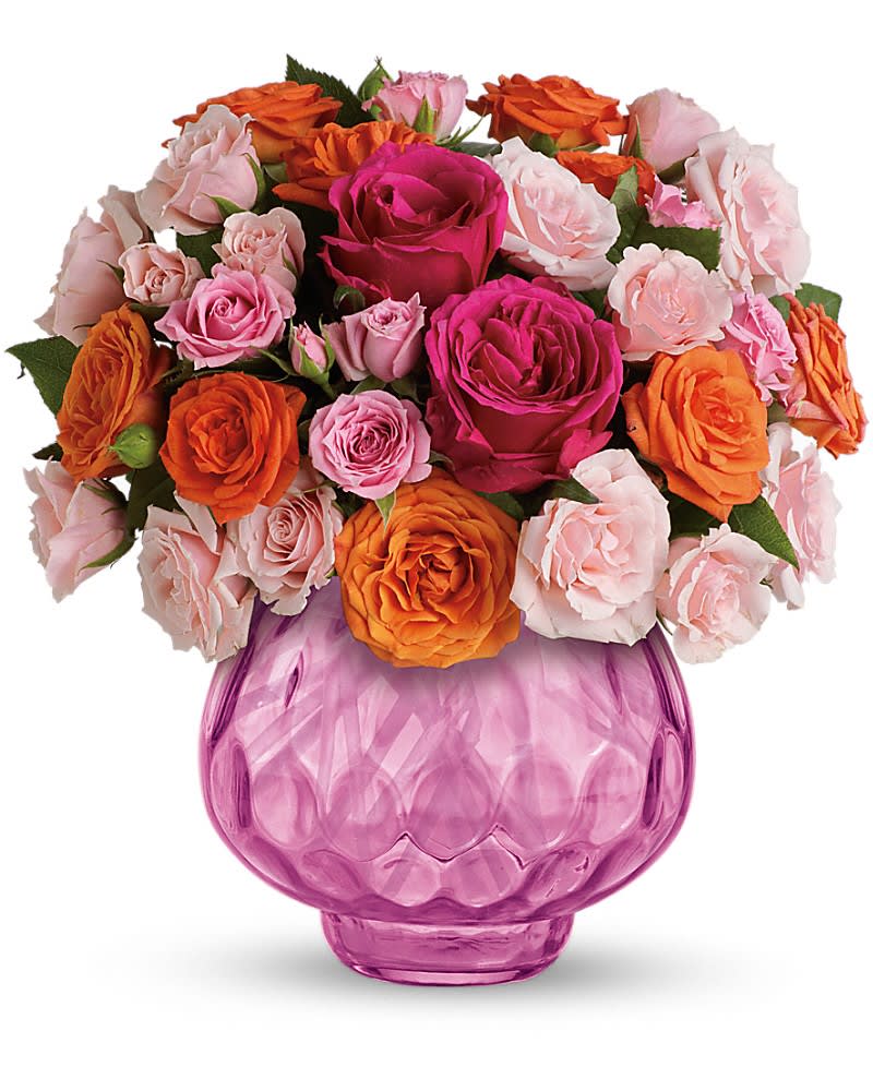 Teleflora's Sweet Fire Bouquet with Roses Teleflora's Sweet Fire Bouquet with Roses - Glorious with multicolored roses. Enchanting with candlelight. This exciting bouquet featuring a sparkling pink cut-glass votive bowl is a gift they'll enjoy now and for years to come. Guaranteed to bring a special glow to any occasion. The gorgeous bouquet includes hot pink roses light pink spray roses pink spray roses and orange spray roses. Delivered in a stunning pink cut-glass votive bowl.
