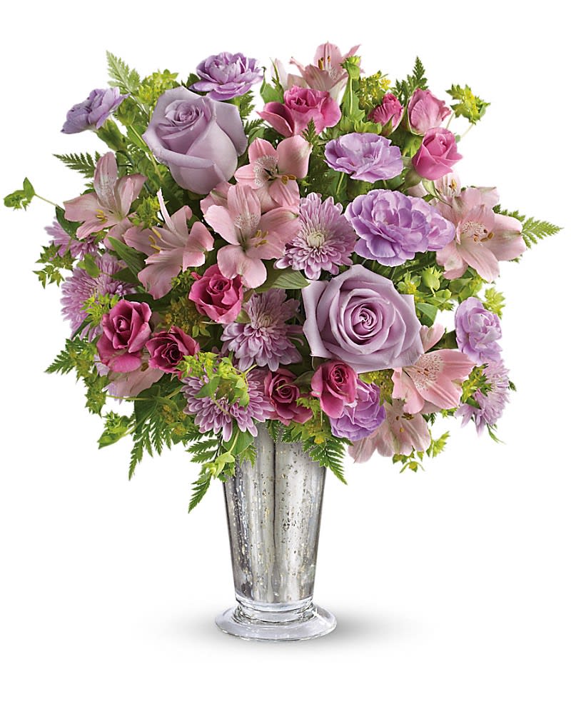 Teleflora's Sheer Delight Bouquet - The essence of femininity. Delight her with flirty-fun lavender and pink blooms presented in a gorgeous Mercury Glass julep vase. It&#039;s a gift that will sparkle in her memory forever. Includes lavender roses pink alstroemeria miniature lavender carnations and lavender chrysanthemums accented with fresh bupleurum and leatherleaf fern. Delivered in a Mercury Glass large julep vase.