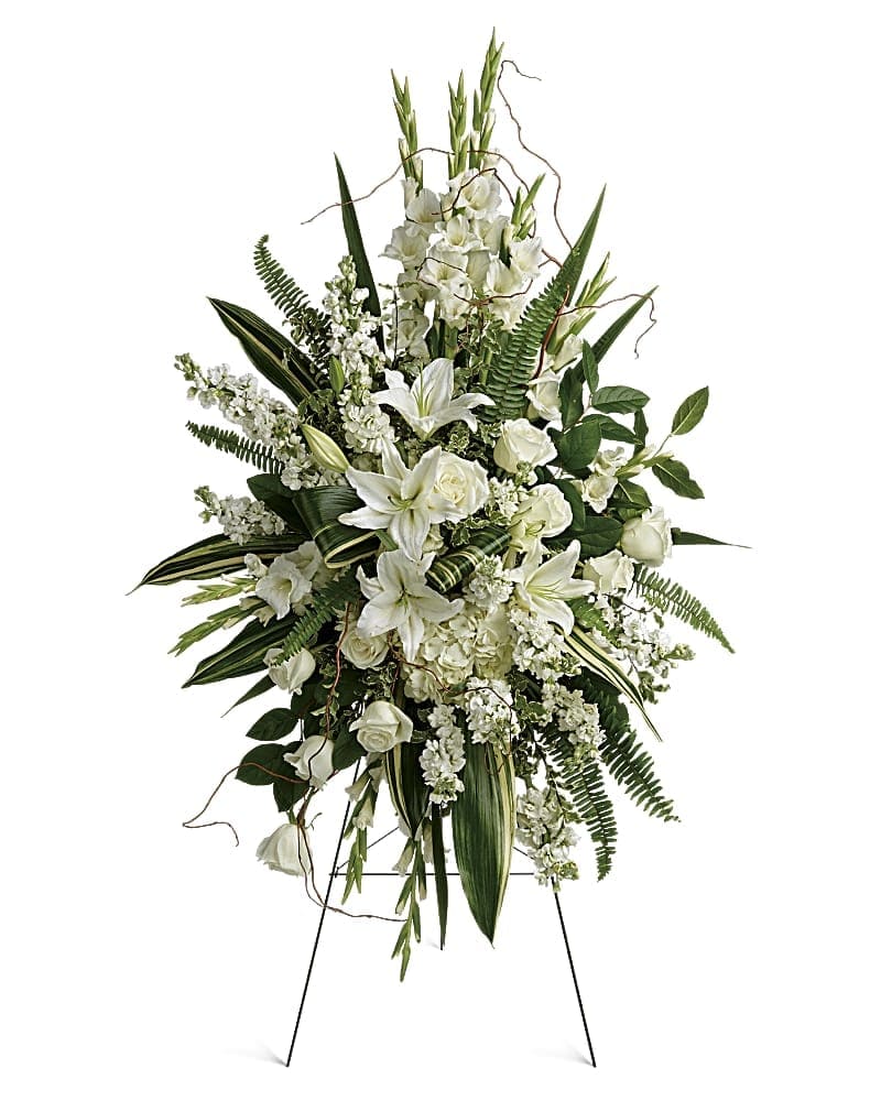 Heartfelt Sympathy Spray - This beautiful spray includes white hydrangea white roses white oriental lilies white gladioli white stock pitta negra sword fern curly willow variegated aspidistra leaves and lemon leaf. Delivered on a wire easel. This beautiful spray includes white hydrangea white roses white oriental lilies white gladioli white stock pitta negra sword fern curly willow variegated aspidistra leaves and lemon leaf. Delivered on a wire easel.