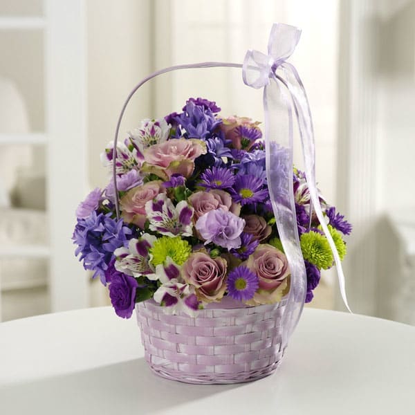 The Greeting Basket - Lavender and lovely, our fresh-packed Greeting Basket features alstroemeria, roses, daisies, mums and more!