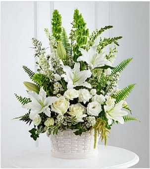 The FTD® In Our Thoughts™ Arrangement The FTD® In Our Thoughts™ Arrangement - The FTD® In Our Thoughts™ Arrangement is a symbol of pure peace and caring kindness. White roses, tulips, freesia, Oriental lilies, double lisianthus, Monte Casino asters and snapdragons are beautifully offset by bright green Bells of ireland, ivy vines, and an assortment of lush greens to create an elegant display that conveys your deepest sympathies for thier loss. Arrives in a large round whitewash basket. GOOD basket includes 25 stems. Approximately 28"H x 22"W. BETTER basket includes 34 stems. Approximately 30"H x 24"W. BEST basket includes 48 stems. Approximately 34"H x 26"W. Your purchase includes a complimentary personalized gift message.