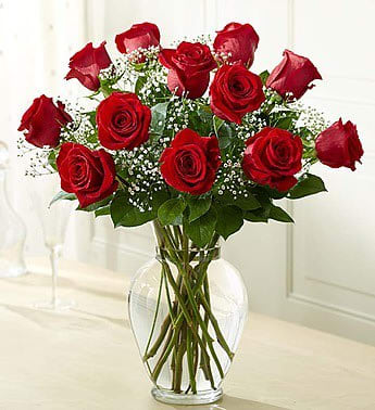 12 Roses Red Rose Elegance Premium 12 Roses Red Rose Elegance Premium - Long-stem red roses are just the gift for the one you can trust, the one you can turn to, the one who loves you above all else and knows your heart inside out. Give the ultimate expression of romance with this stunning, hand-crafted arrangement of long-stem red roses in a classic glass vase. A gift of love they'll always remember--and so will you.