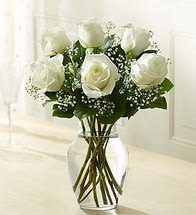 6 Stems White Love's Embrace Roses - Bring a smile or a meaningful embrace to their day with six lovely, long-stem white roses, beautifully arranged by our expert designers with fresh greens in a glass vase. It's the perfect &quot;just because&quot; or &quot;I love you&quot; surprise.