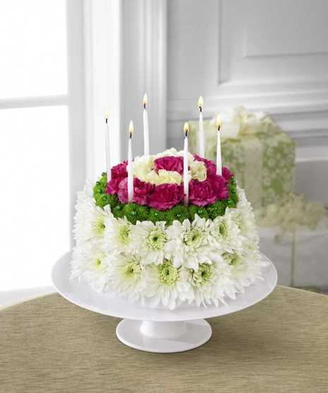 Blooming Flower Cake Blooming Flower Cake - Send this Beautiful Birthday Cake! We Guarantee it to Be a Hit and Promise No One Will Gain a Calorie. It Contains No Cholesterol, No Sodium, and No Sugar and it Is Made Entirely of Fresh colorful Flowers!