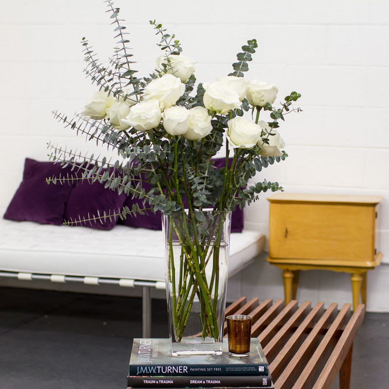 English Garden with White Long Stem Roses - This Stunning &amp; Sophisticated Arrangement is filled with One Dozen White Long Stem Roses and Ethereal Eucalyptus.  