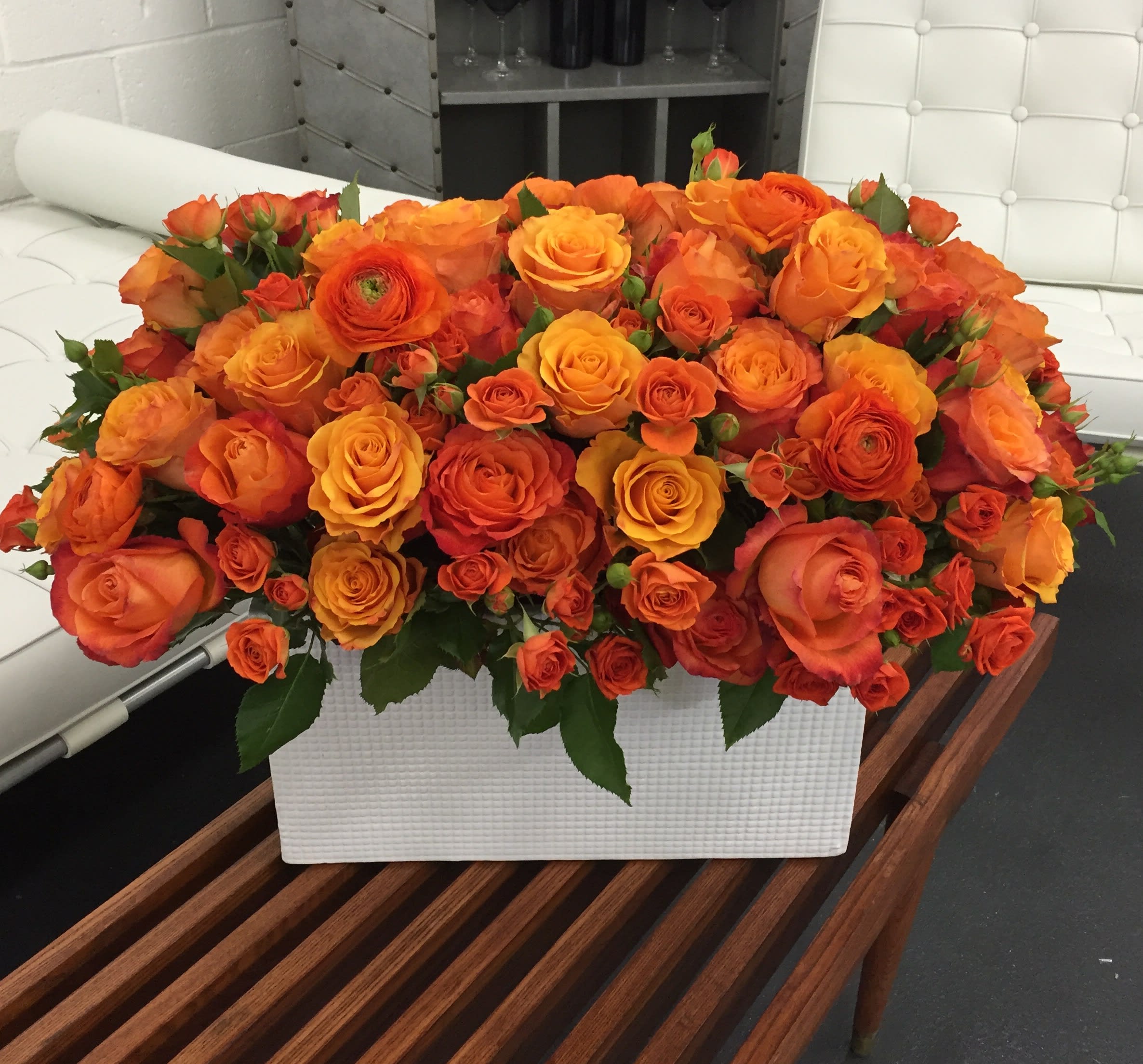Grand Rhapsody in Orange Grand Rhapsody in Orange - Dress to Impress with this Stylish and Sophisticated Statement Arrangement!