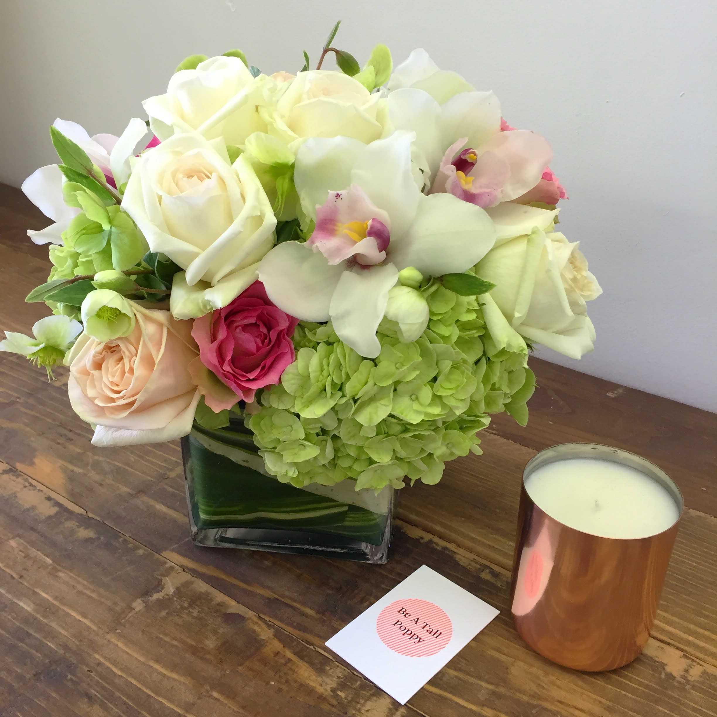 She Will Love It!! - The Perfect Little Something to Show You Care!  She will LOVE the Soft Orchids and Beautiful Fragrant Filled Roses! This Arrangement is a MUST!